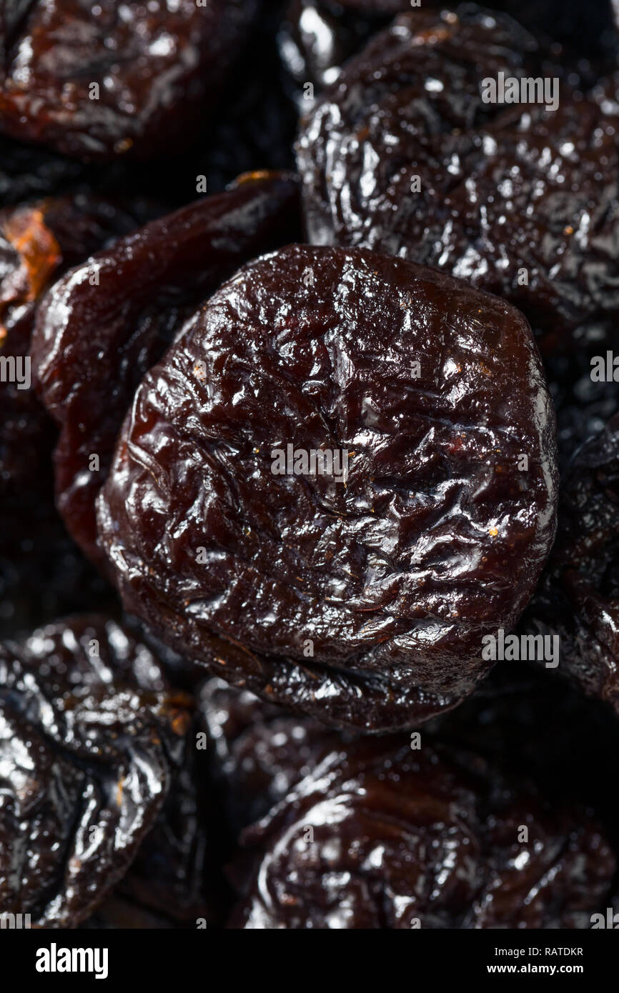 Raw Organic Dry  Prunes in a Bowl Stock Photo