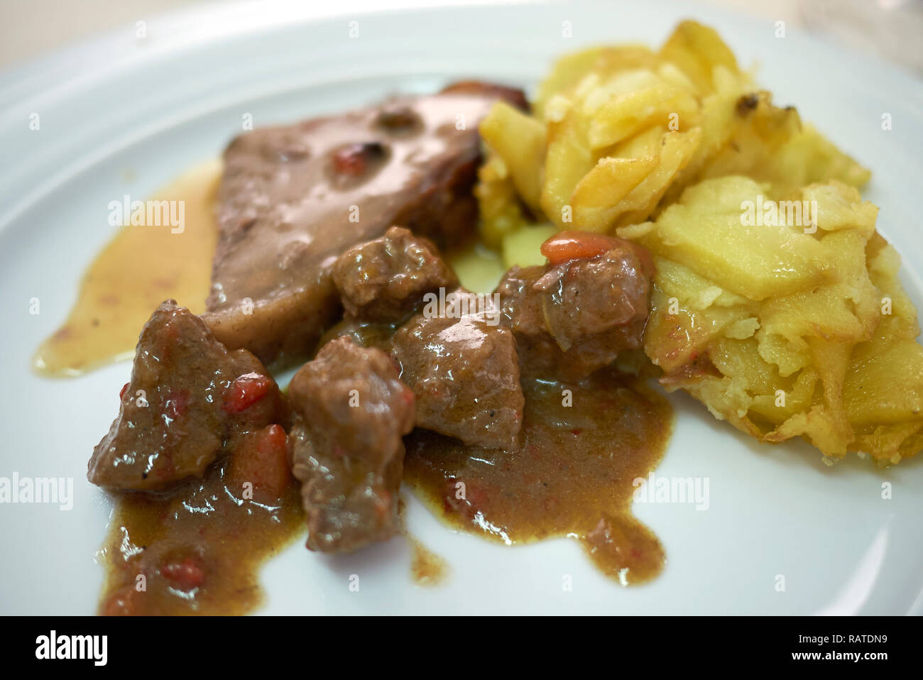 Roasted podolica meat with roasted potatoes Stock Photo