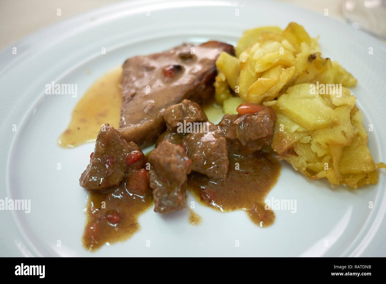Roasted podolica meat with roasted potatoes Stock Photo