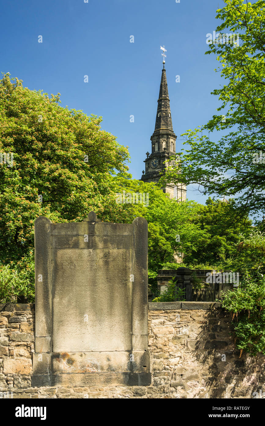 The clock tower of the St. Cuthbert Church in downtown Edinburgh