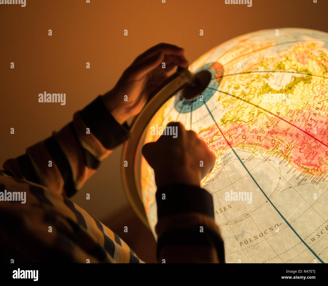 looking for a location on an earth model map Stock Photo