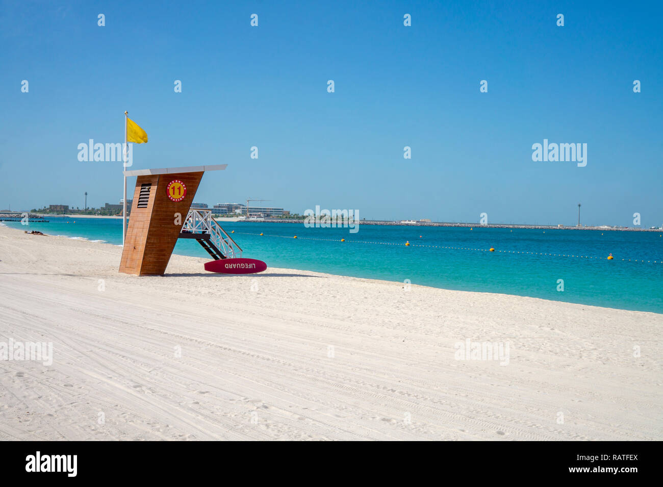Emergency services hut on a sunny Jumeirah beach, in Dubai with blue sea Stock Photo