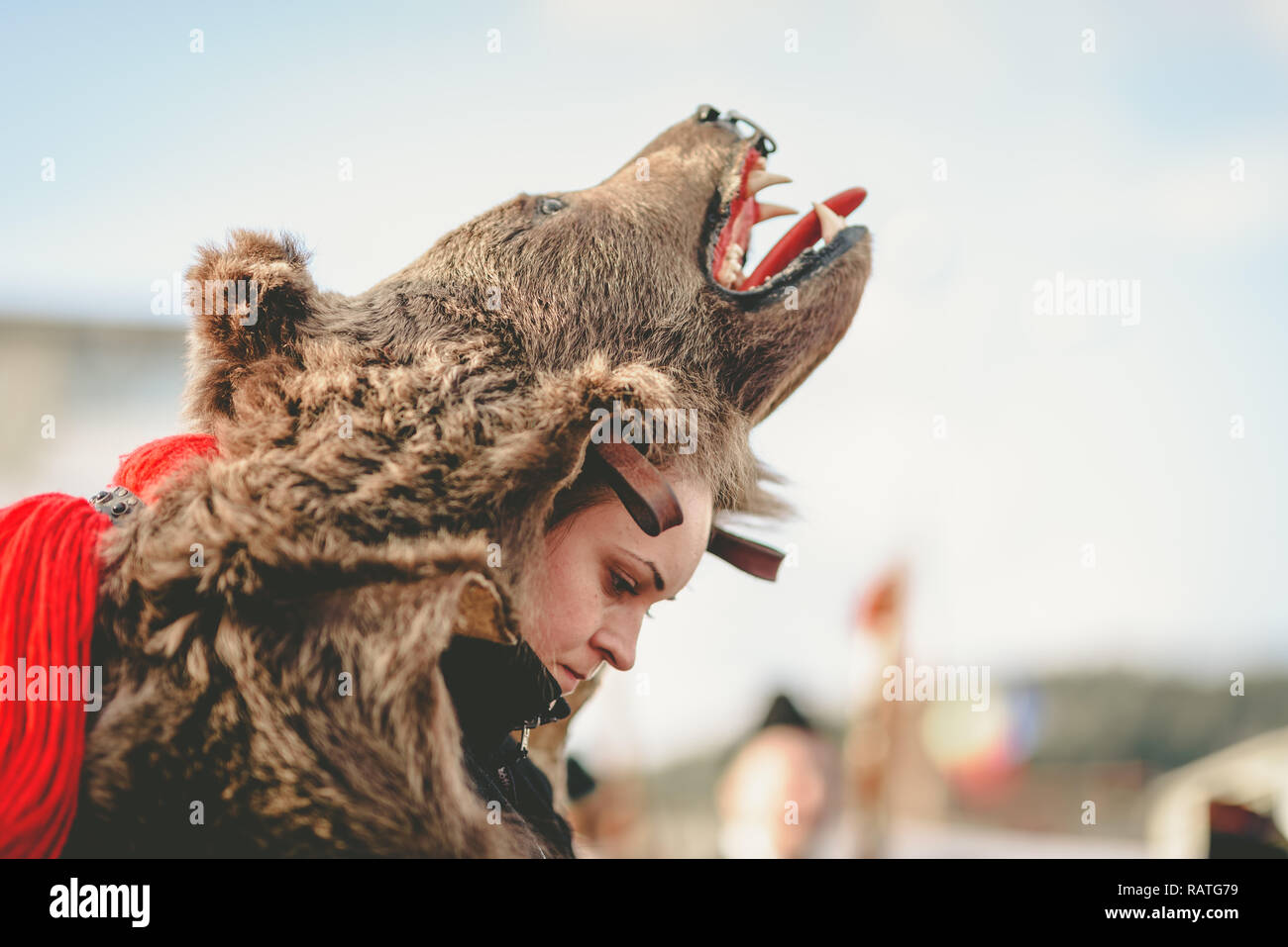 Girl resting in bear suit. Stock Photo