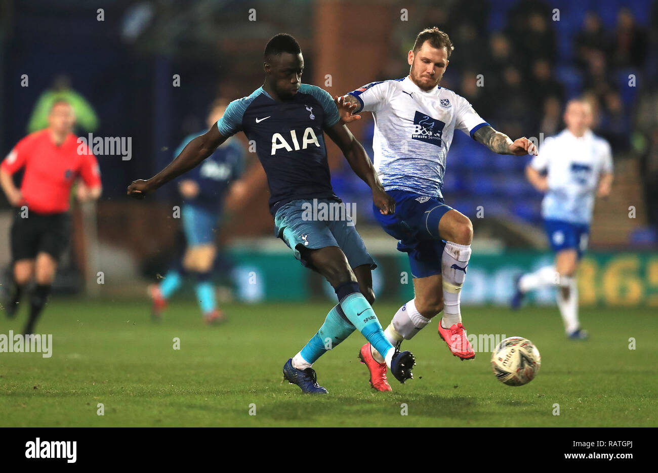 Tottenham Hotspur's Davinson Sanchez (left) and Tranmere Rovers' James Norwood battle for the ball during the Emirates FA Cup, third round match at Prenton Park, Birkenhead. Stock Photo