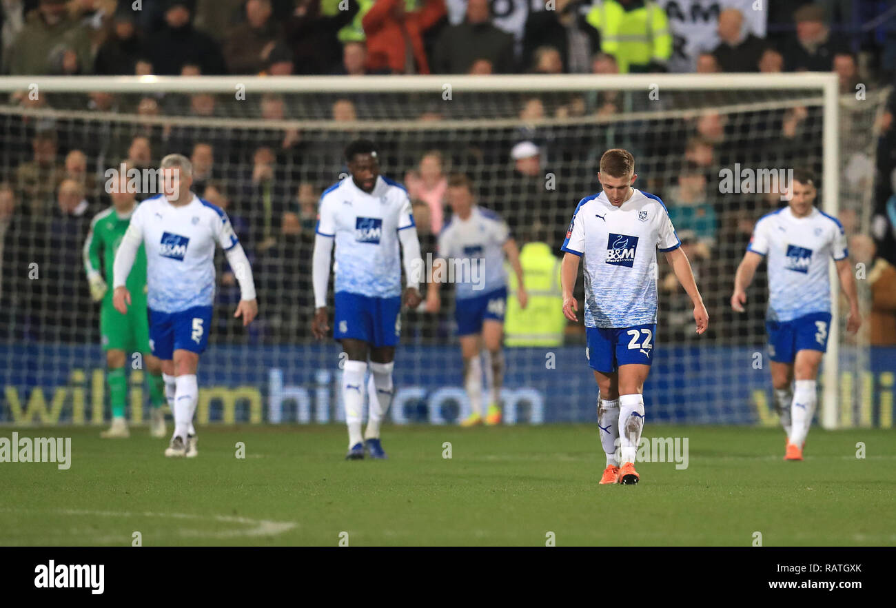 Tranmere Rovers players appear dejected after conceeding during the Emirates FA Cup, third round match at Prenton Park, Birkenhead. Stock Photo