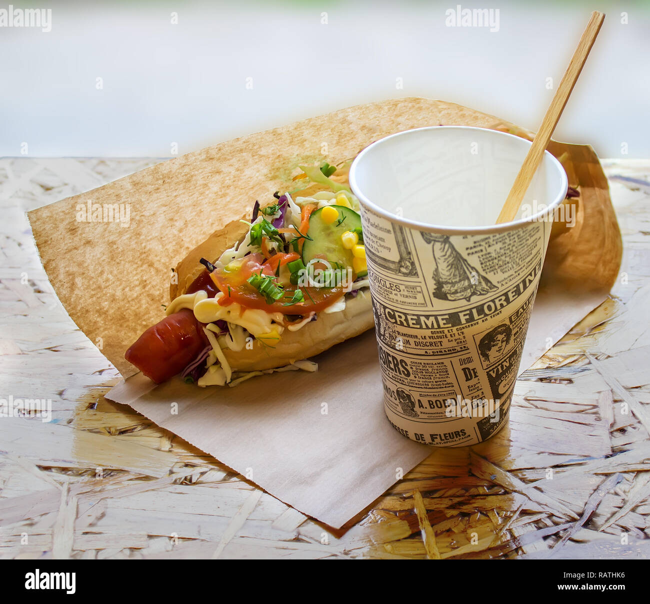 Street food, hot hotdog packed in a paper bag Stock Photo - Alamy