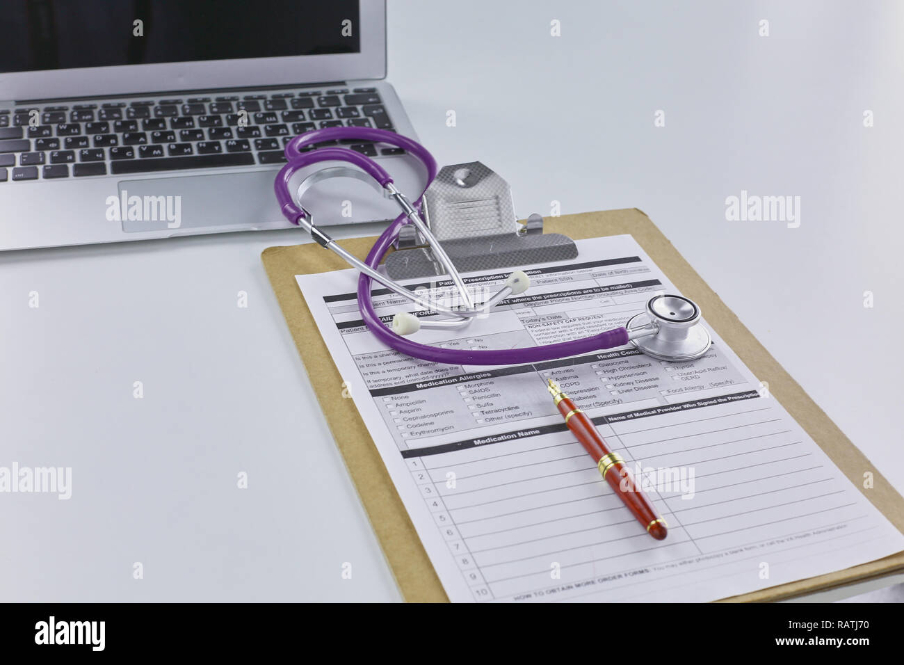 Doctor's workspace working table with patient's discharge blank paper ...