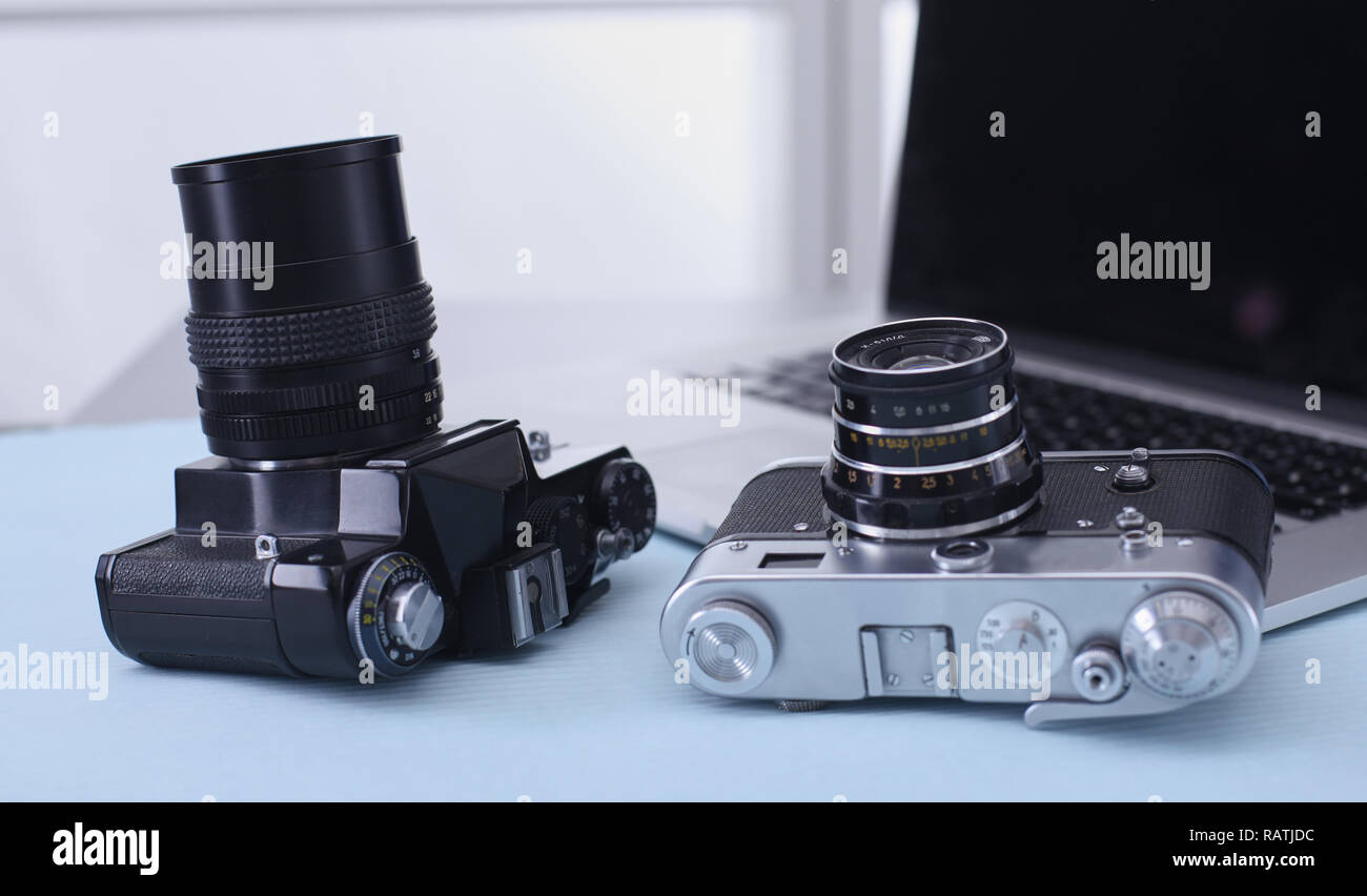 Computer keyboard, mouse and camera lie on table. Stock Photo