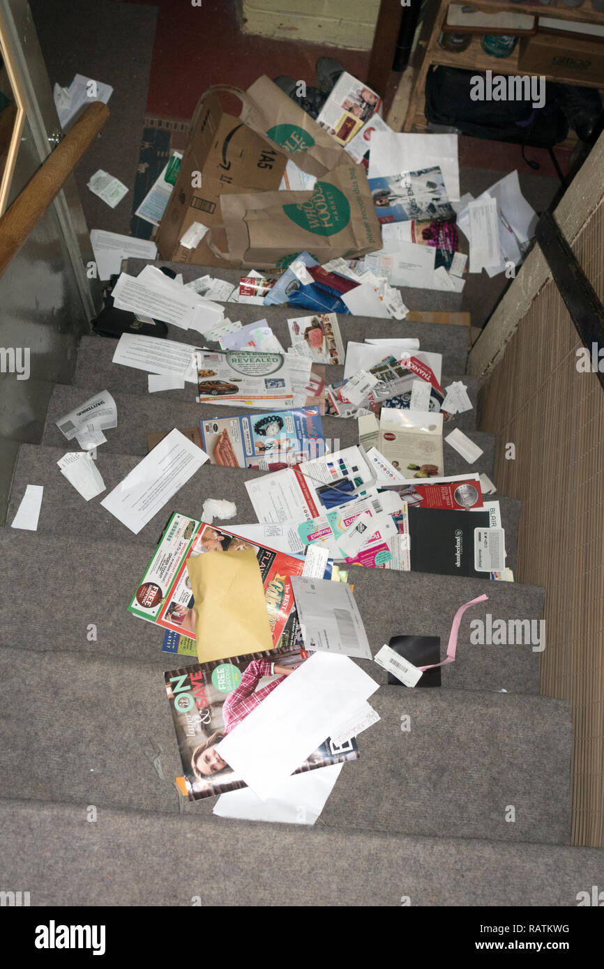 Broken grocery bag of recycle material fallen down the stairs. 