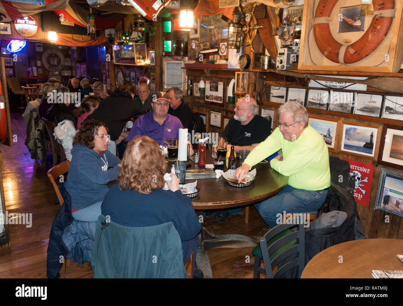 Group enjoying a meal at the Anchor Bar with a nautical motif. Superior
