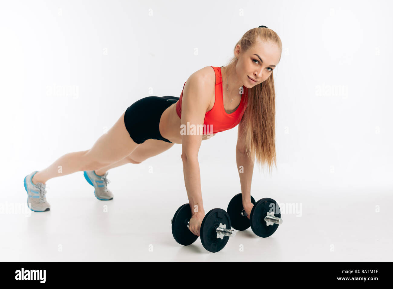awesome bodybuilder in pushing position Stock Photo - Alamy