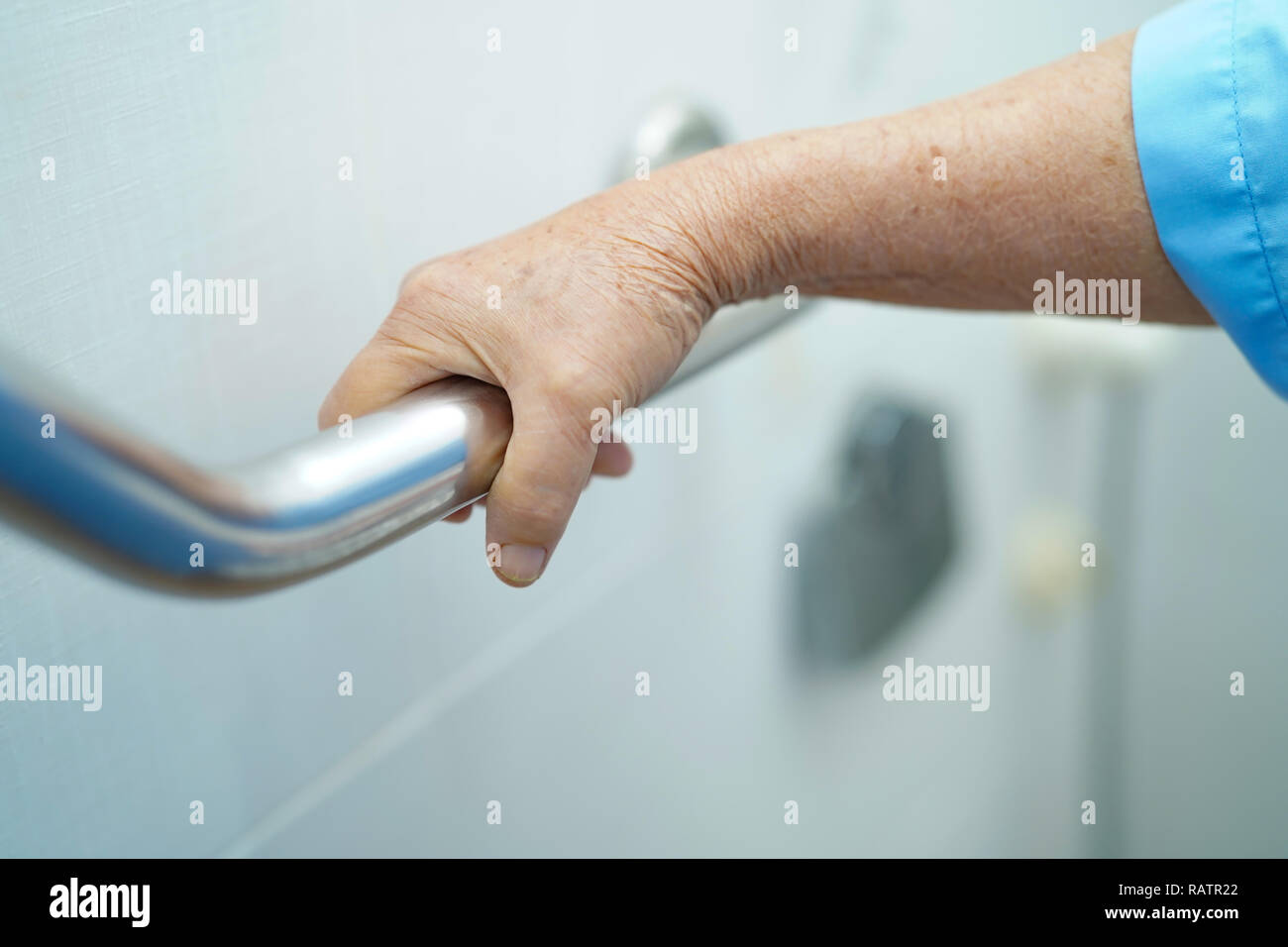 Asian senior or elderly old lady woman patient use toilet bathroom handle security in nursing hospital ward : healthy strong medical concept. Stock Photo