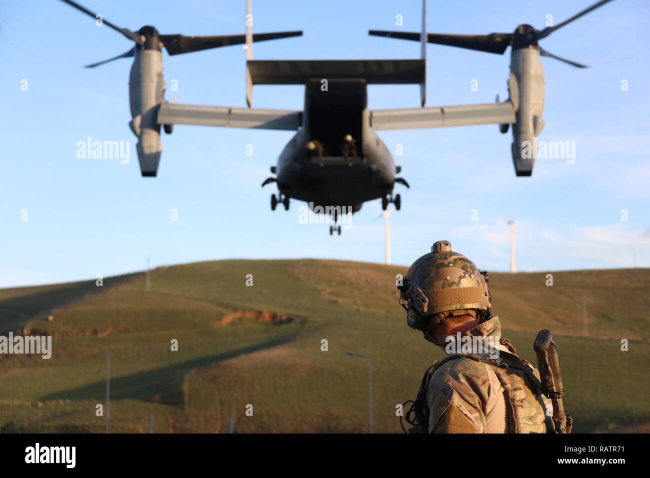 A U.S. Air Force Pararescue Jumper attached to Special Purpose Marine Air-Ground Task Force-Crisis Response-Africa 19.1 rehearses hoist-rescue operations on and off an MV-22 Osprey at Naval Air Station Sigonella, Italy, Dec. 20, 2018. SPMAGTF-CR-AF is deployed to conduct crisis-response and theater-security operations in Europe and Africa. (U.S. Marine Corps photo by 1stLt Christin St. John) Stock Photo