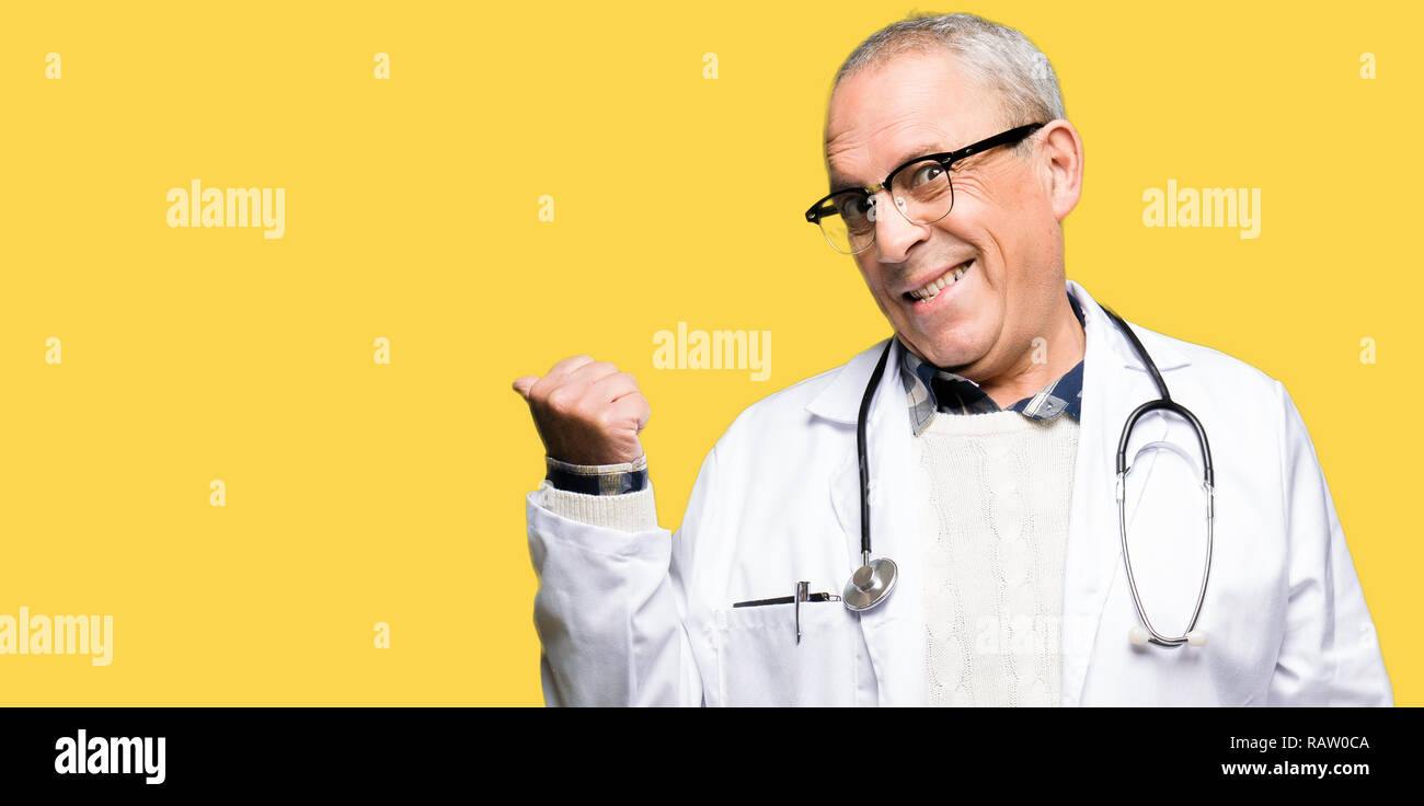 Cheerful senior doctor thumb up hi-res stock photography and images - Alamy