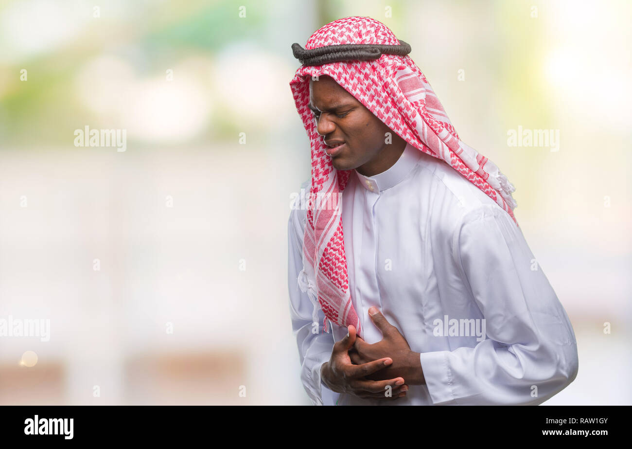 Young arabic african man wearing traditional keffiyeh over isolated ...