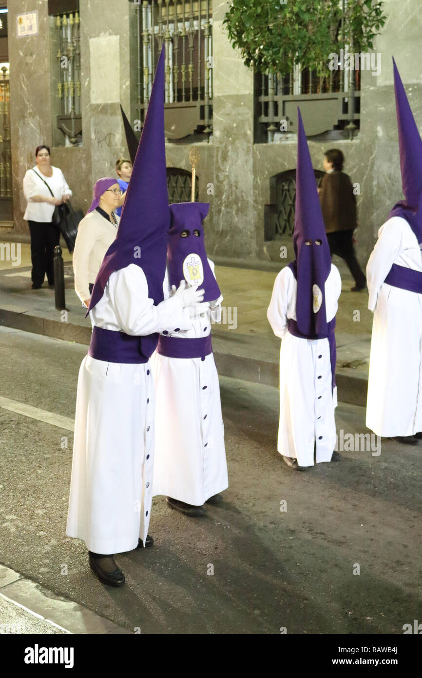 Some members of a catholic brotherhood wearing the traditional Capirote  pointed hat during the Holy Week procession in Zaragoza, Aragon region,  Spain Stock Photo - Alamy