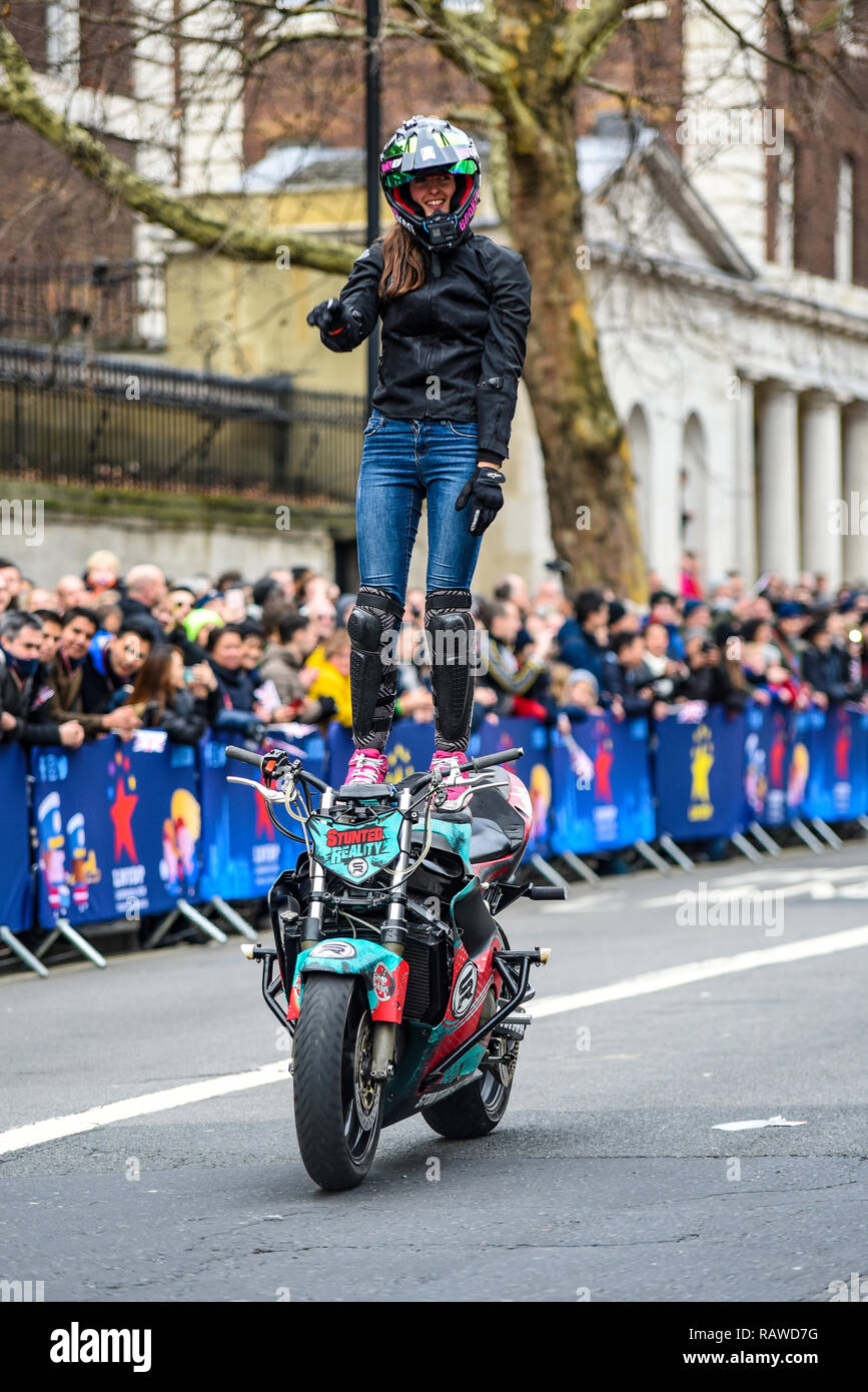 Moto Stunts International motorbike display team at London New Year's Day  Parade. Cassandra Ryder of Stunted Reality motorcycle stunt in Whitehall  Stock Photo - Alamy