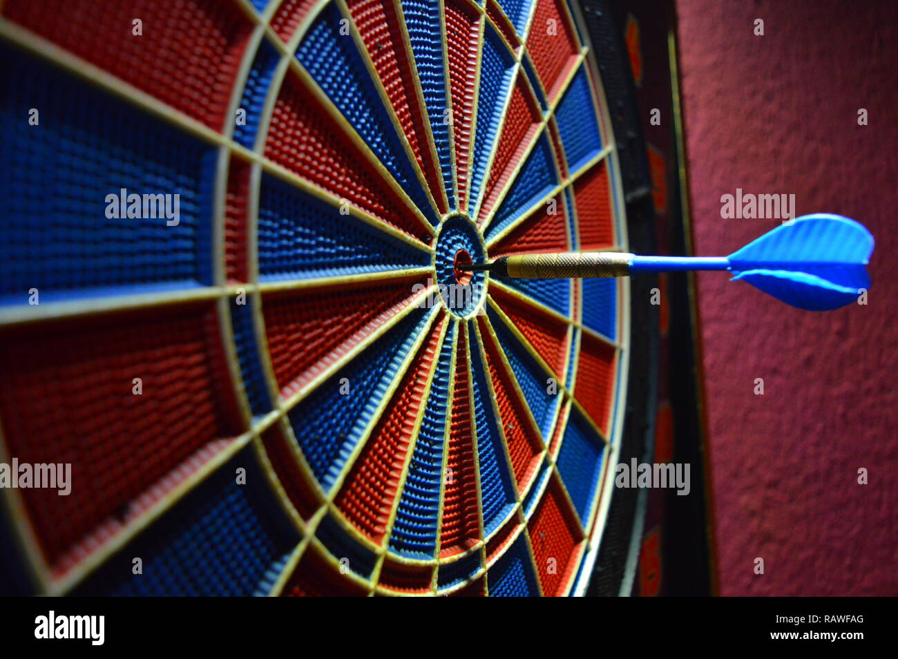 Game of darts, playing darts hitting bulls eye Stock Photo - Alamy