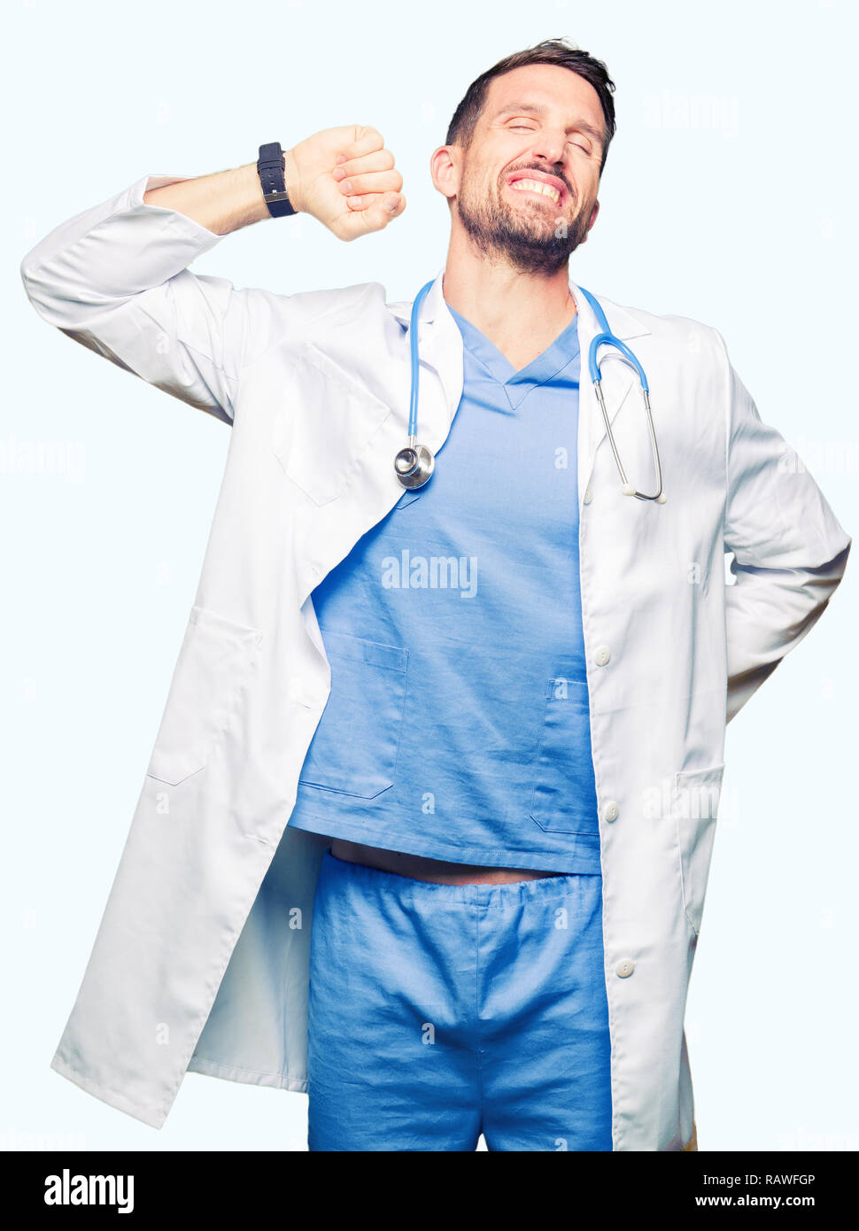Handsome doctor man wearing medical uniform over isolated background ...