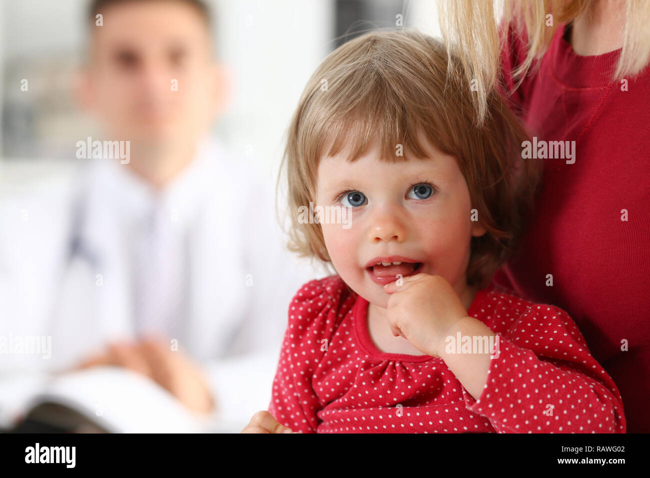 Little child with mother at pediatrician reception Stock Photo Alamy
