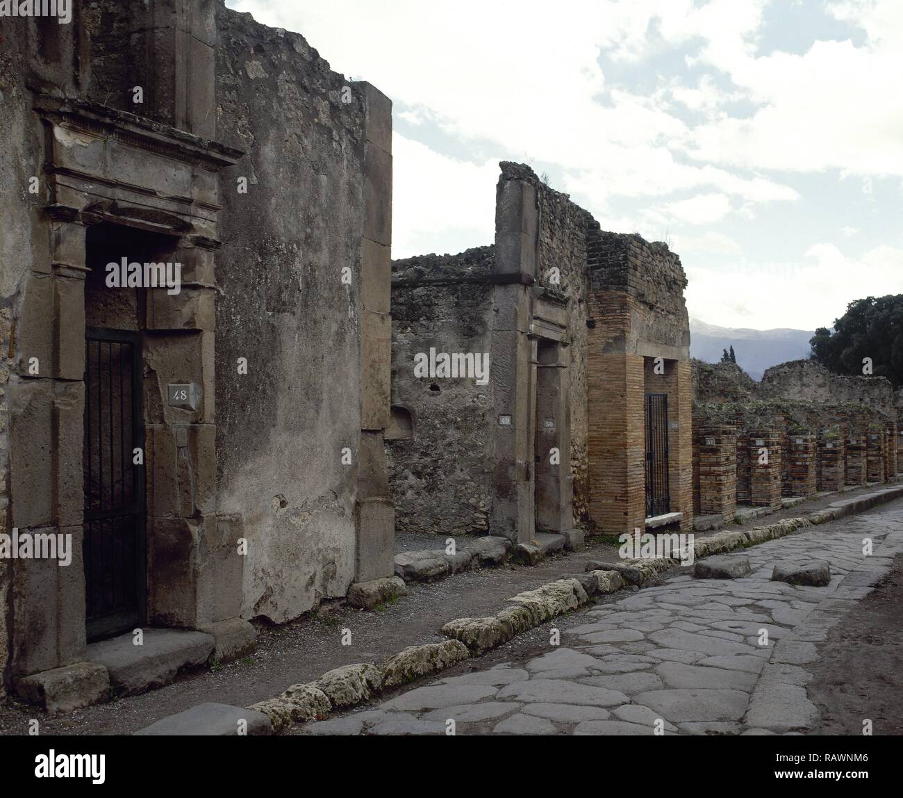 Italy. Pompeii. Roman city destroyed in 79 AD by the eruption of Vesuvius. General view of Via Lupanare. Campania. Stock Photo