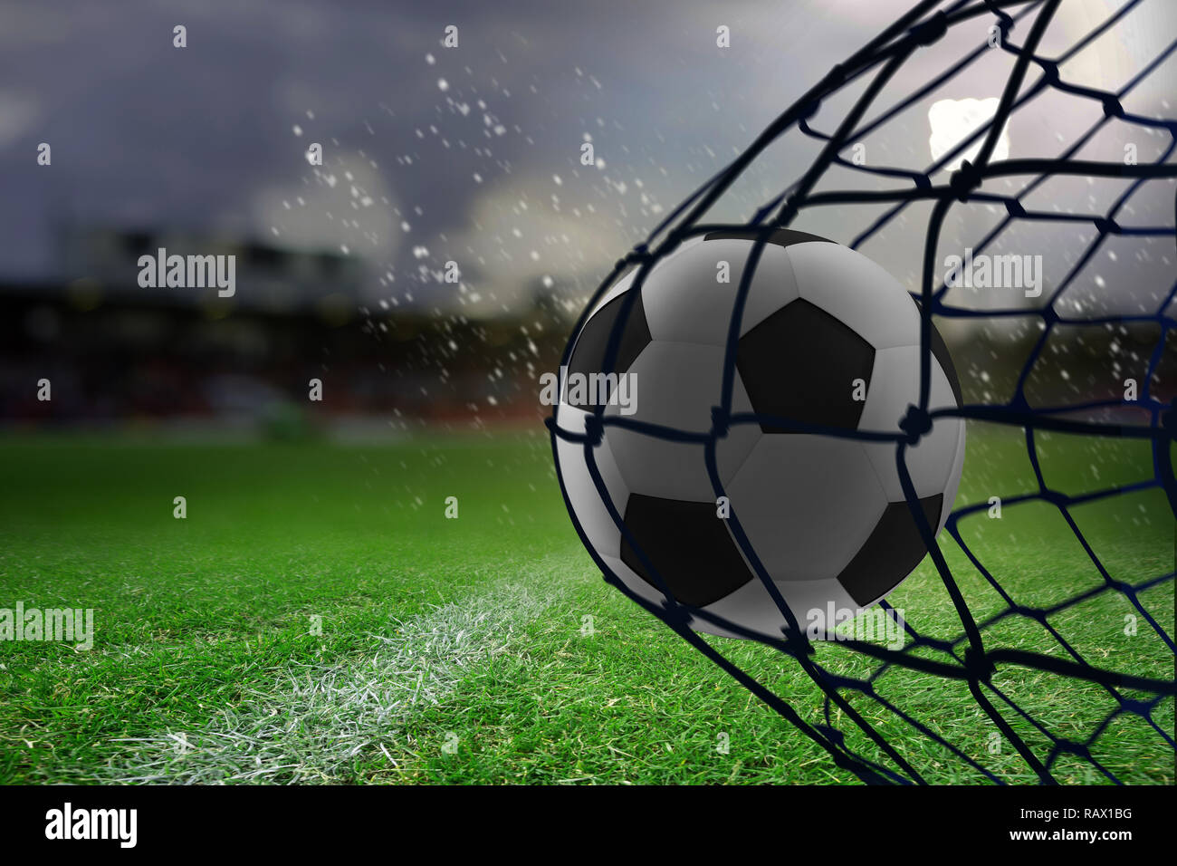Composite image of football hitting the back of the net Stock Photo Alamy