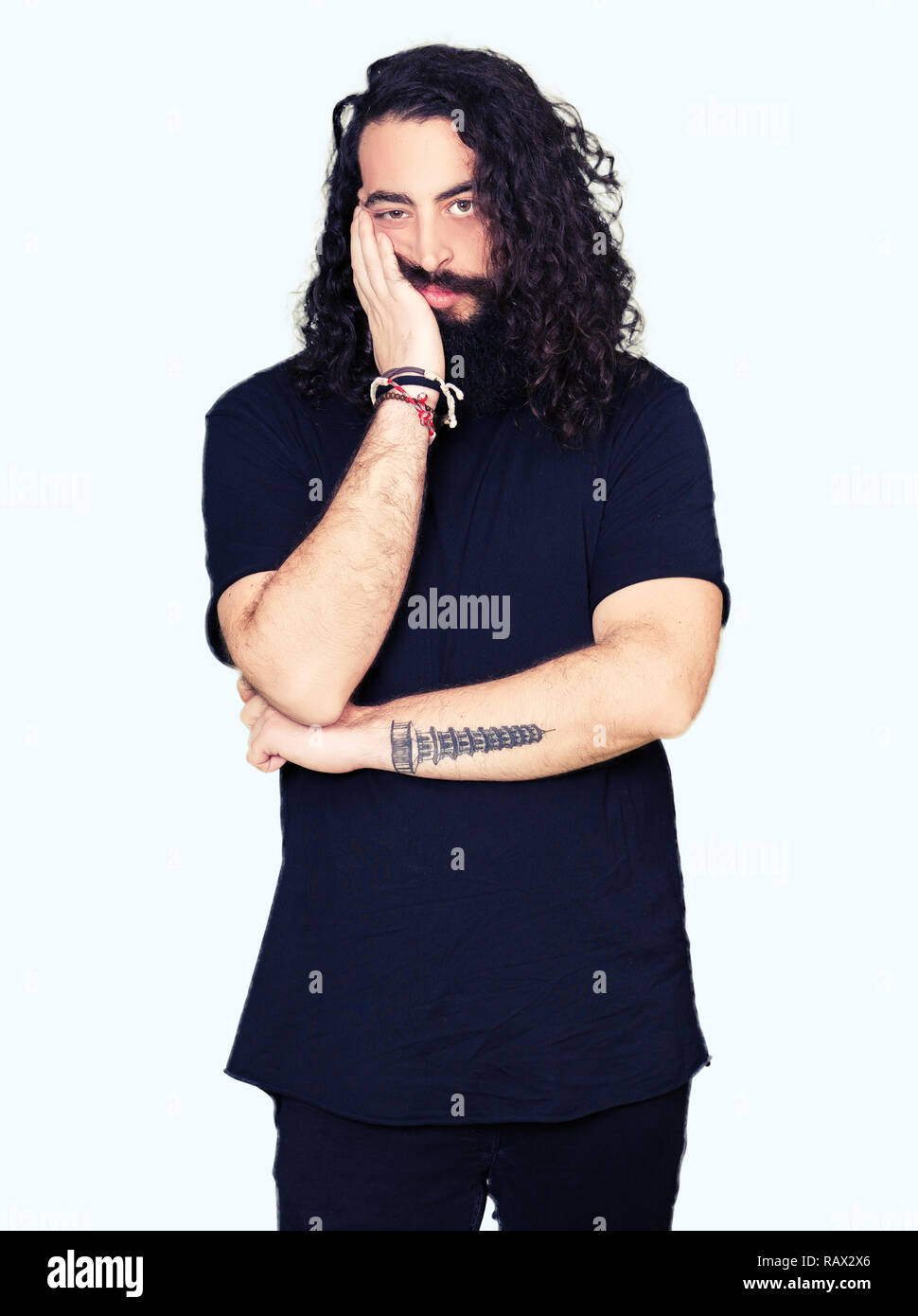 Young Man With Long Hair And Beard Wearing Heavy Metal Black