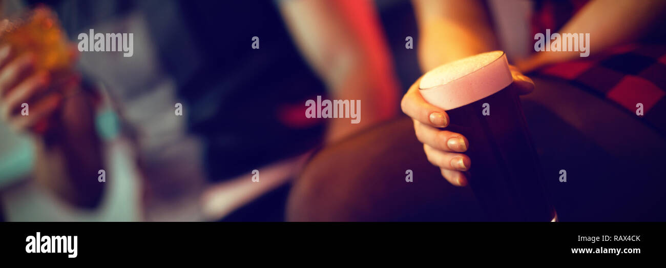 Woman holding a glass of drink Stock Photo