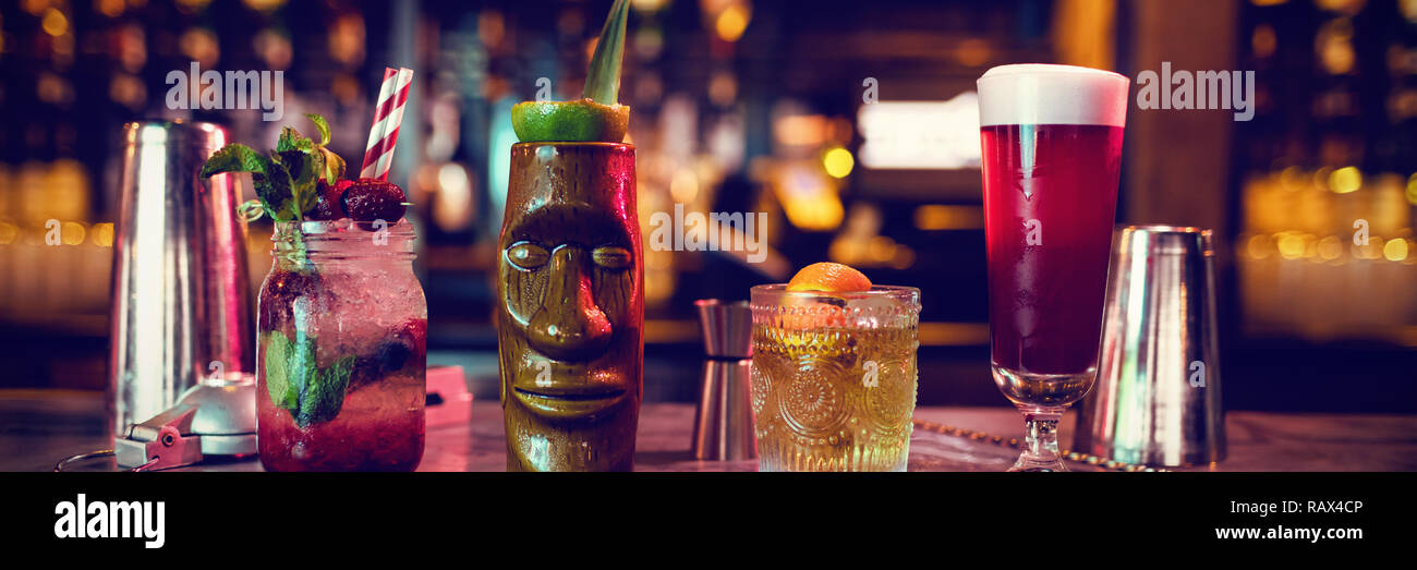 Bar accessories with cocktails on counter Stock Photo Alamy