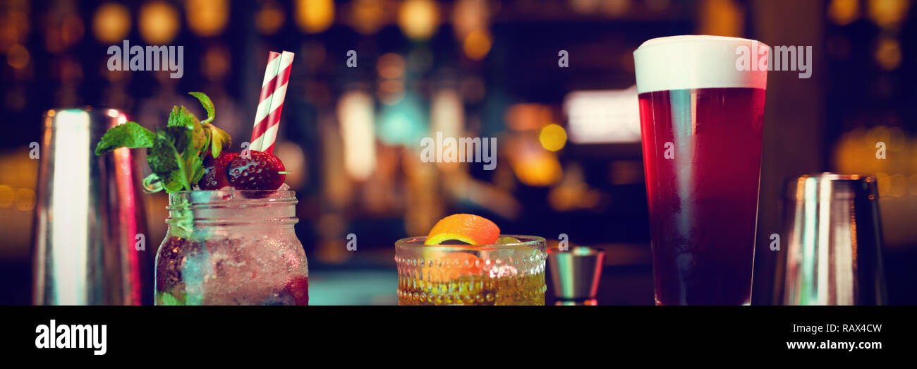 Bar accessories with cocktails on counter Stock Photo Alamy
