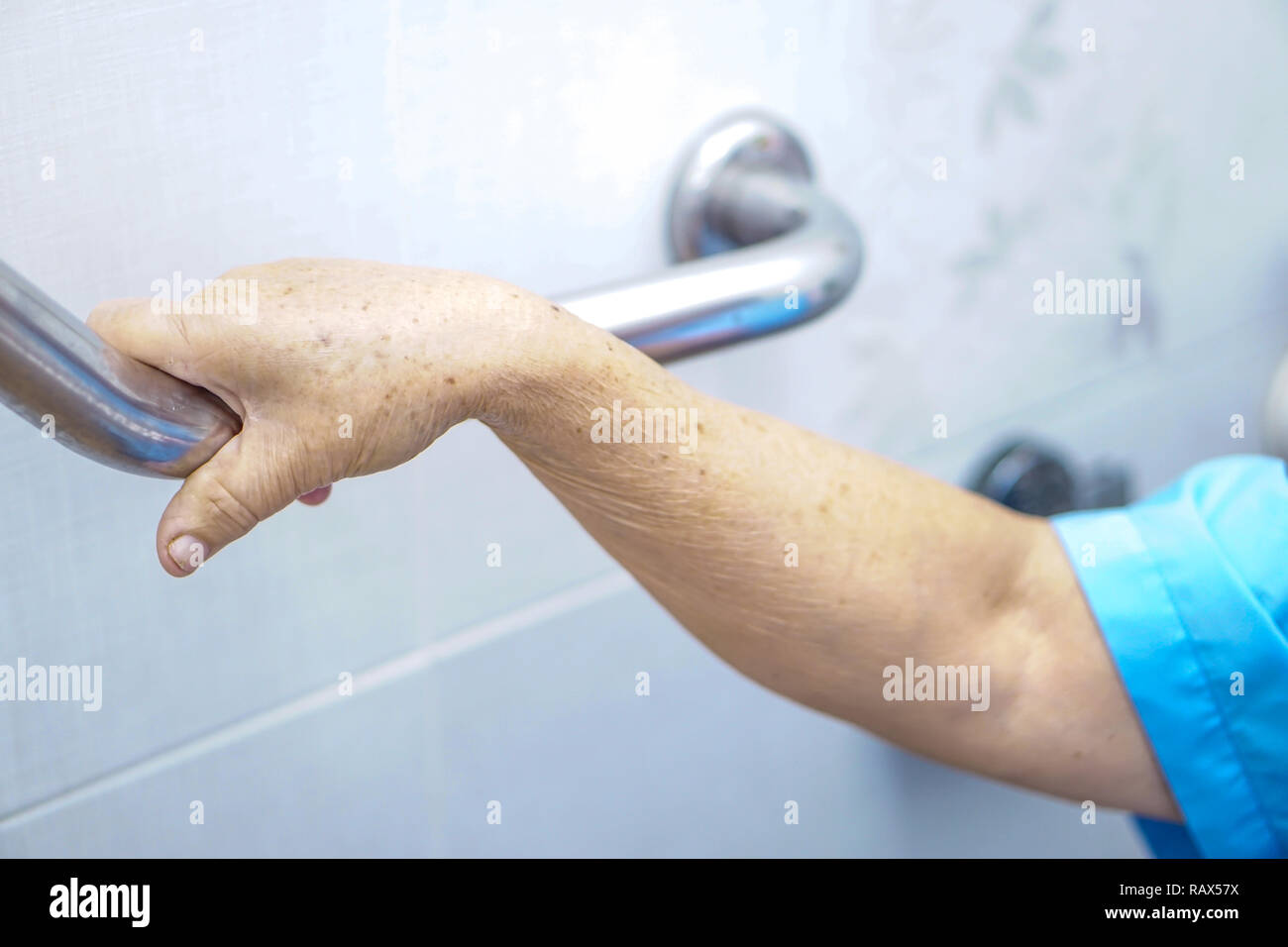 Asian senior or elderly old lady woman patient use toilet bathroom handle security in nursing hospital ward : healthy strong medical concept. Stock Photo