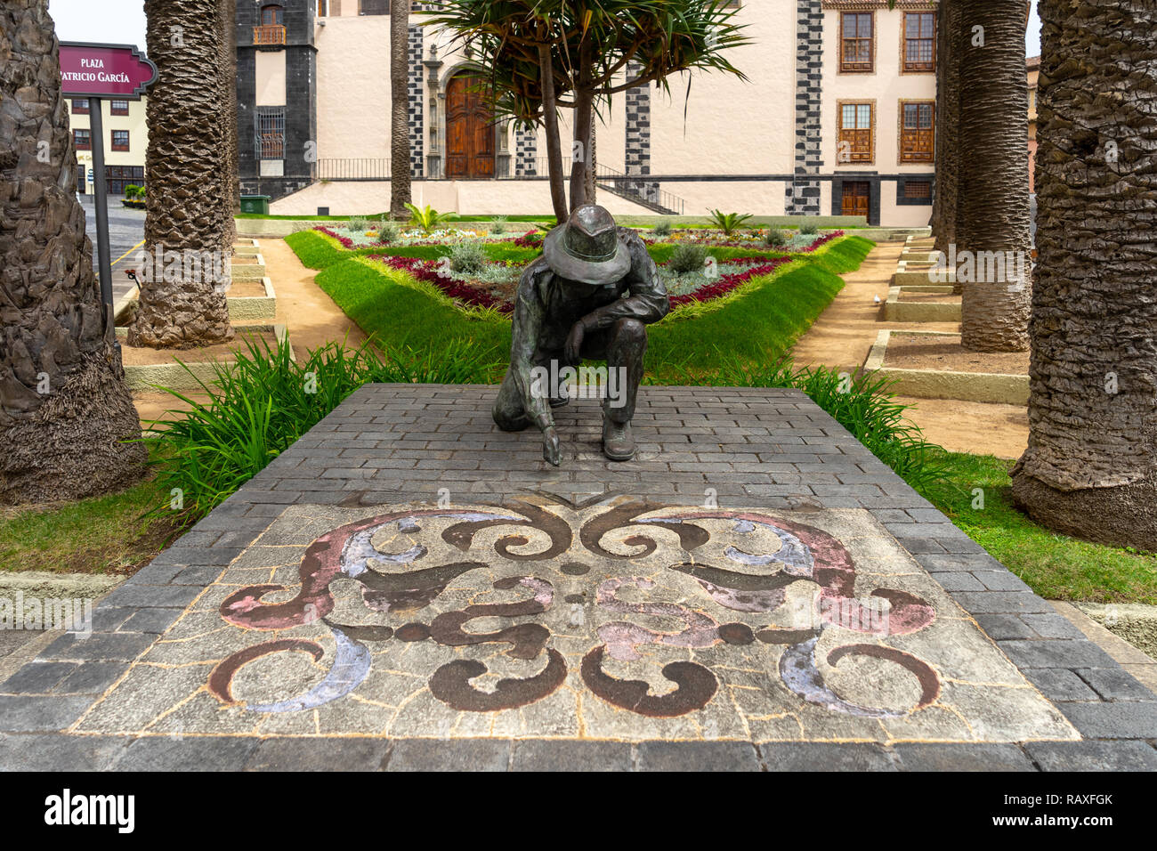 LA OROTAVA, TENERIFE, CANARY ISLANDS, SPAIN - JULY 25, 2018: A monument to the makers of sand and flower carpets (Homenaje al Alfombrista) by author J Stock Photo