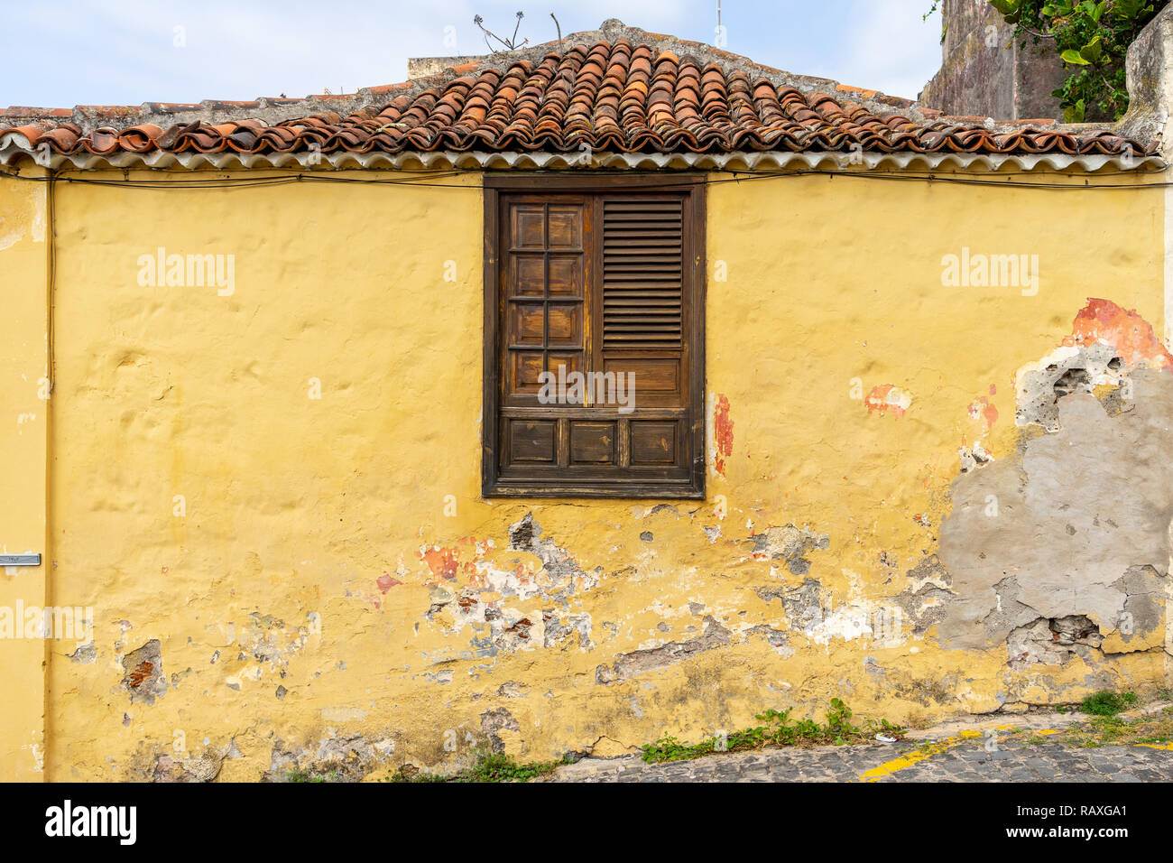 The wall of an old shabby house with a wooden window Stock Photo - Alamy