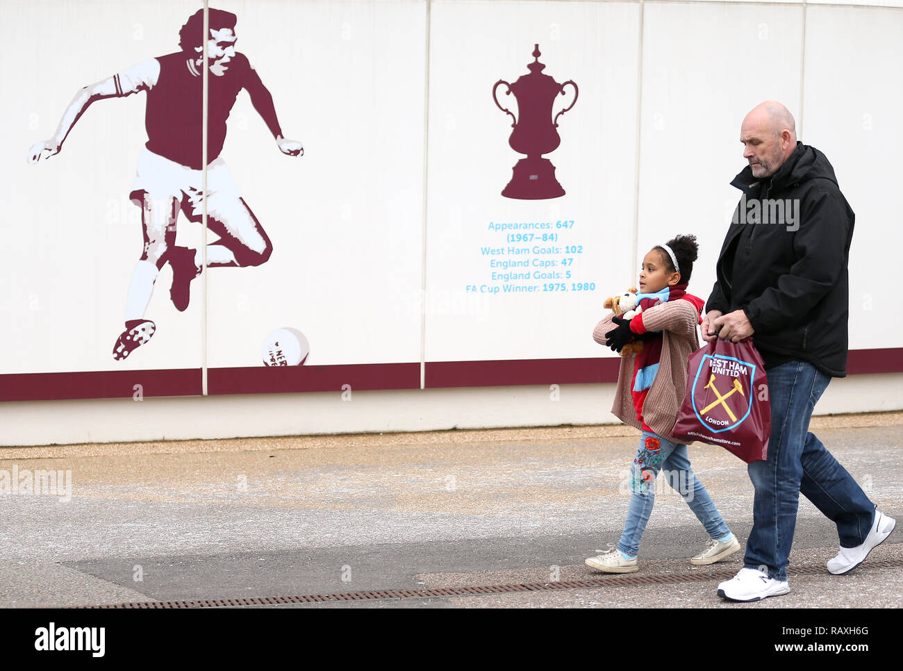 West Ham United fans arriving at the ground before the Emirates FA Cup, third round match at London Stadium. Stock Photo