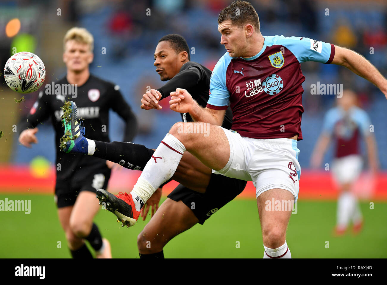 Barnsley S Ethan Pinnock Left And Burnley S Sam Vokes Right Battle For The Ball During The Emirates Fa Cup Third Round Match At Turf Moor Burnley Stock Photo Alamy