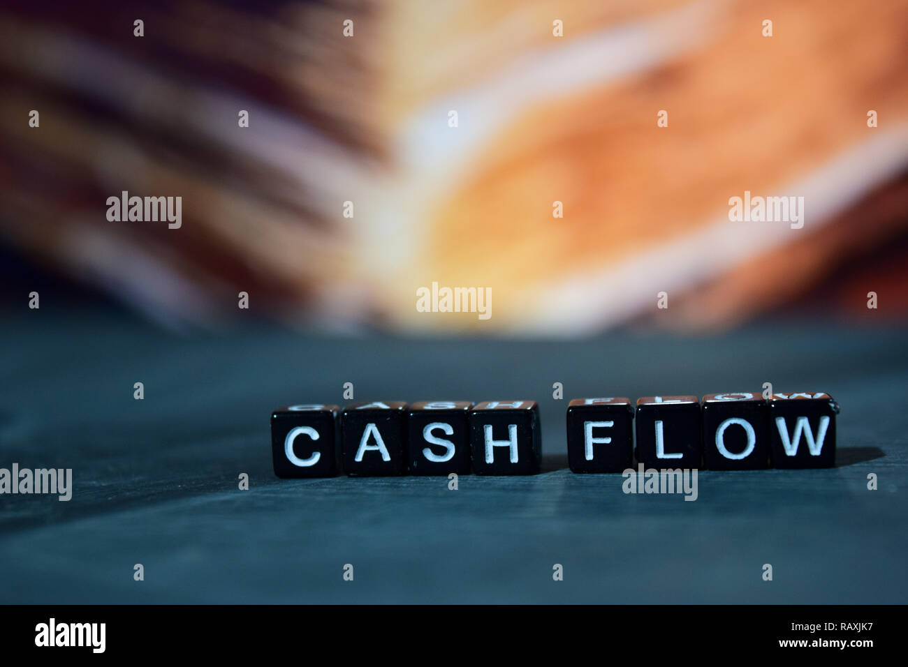 Cash flow on wooden blocks. Business and finance concept. Cross