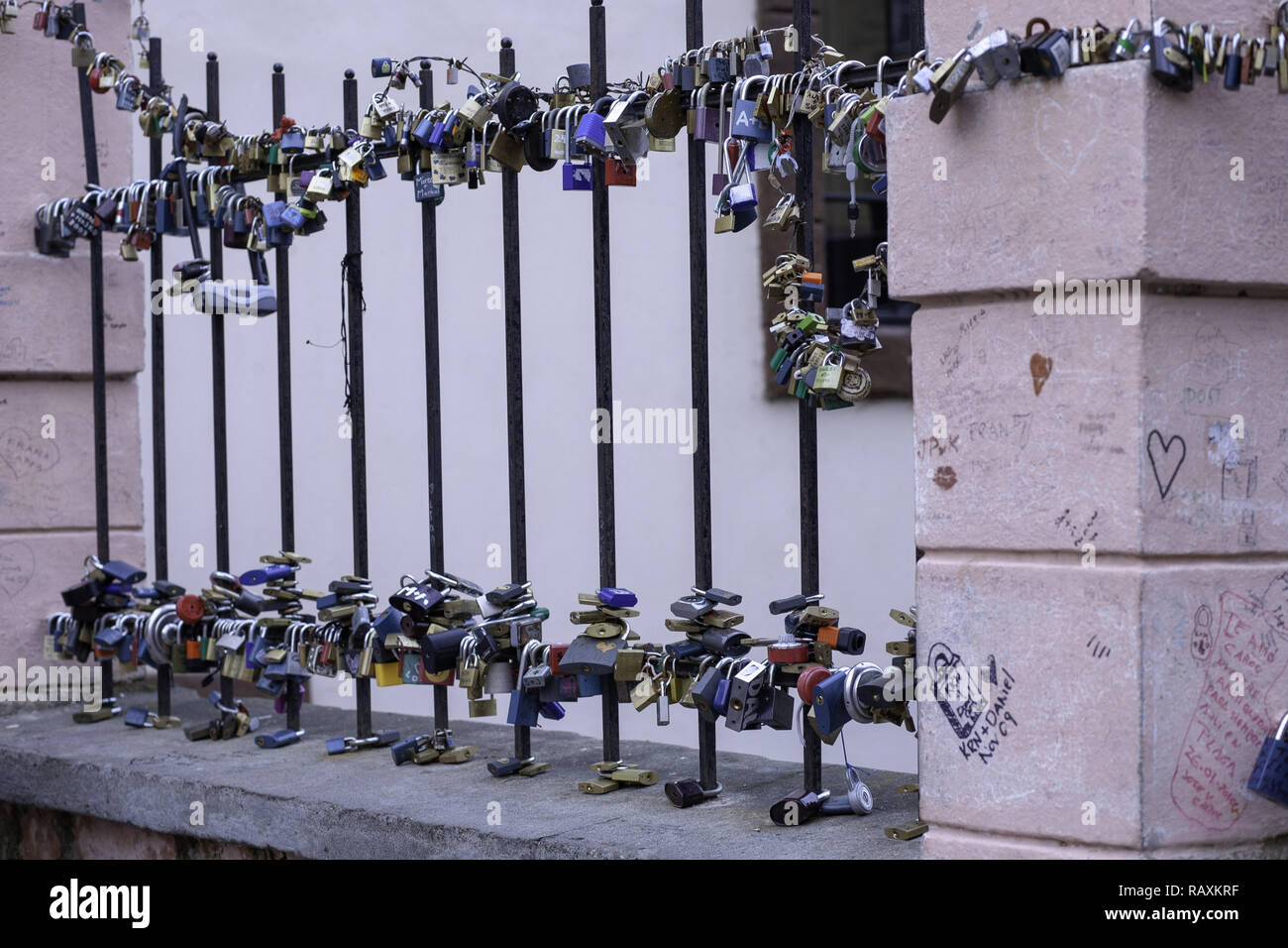 Love lock padlocks attached to the railings of Lovers Bridge in Prague
