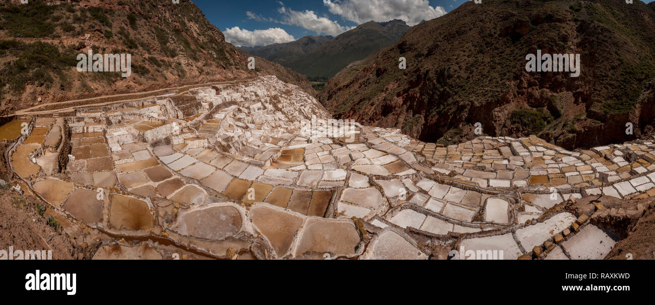 Salt Pans of Maras in Maras, Peru: This Peruvian canyon is filled with geometric salt pools that have been being harvested since the Incan empire Stock Photo