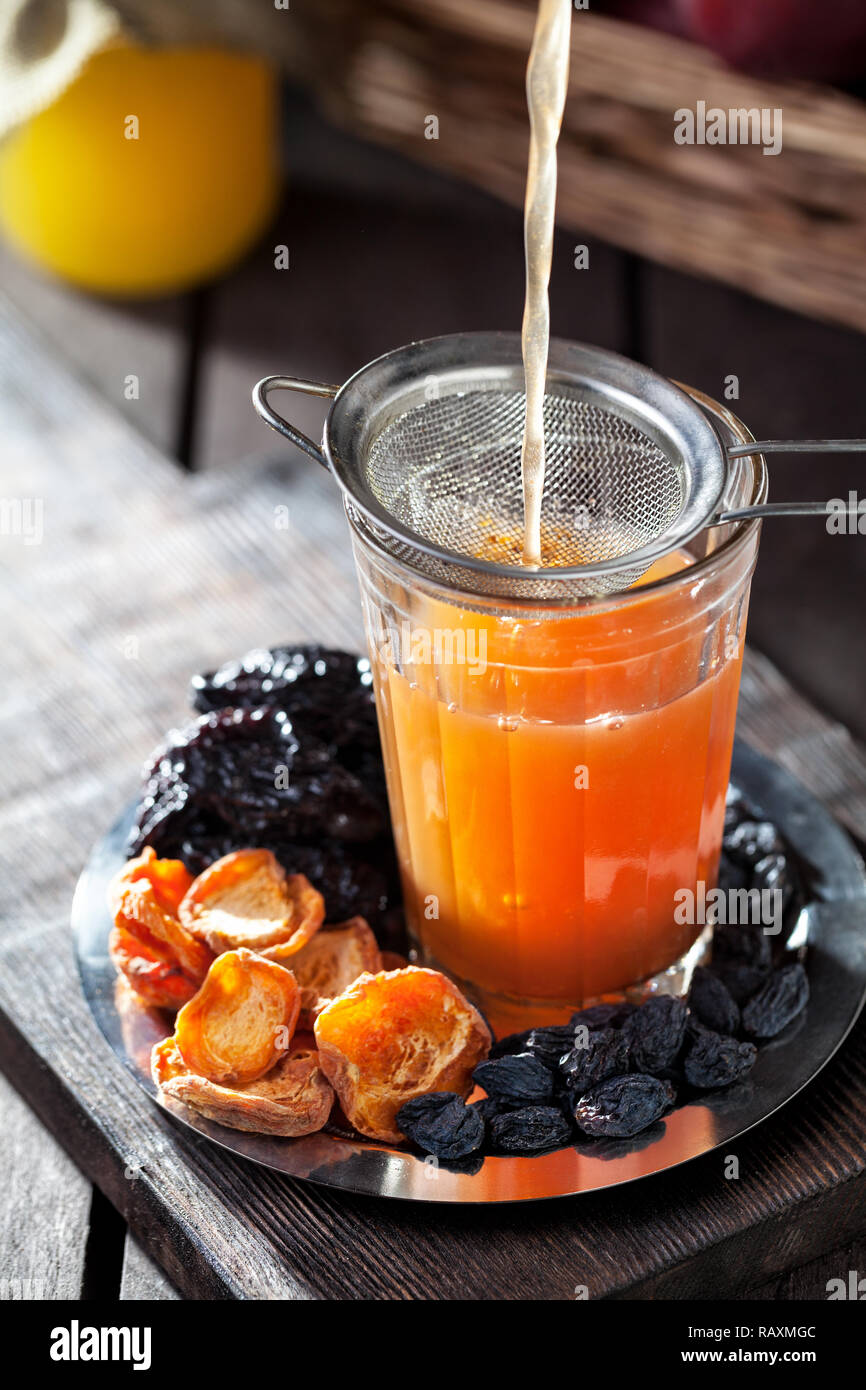 Compote from pumpkin, apples and fry fruits with honey served in Rustic style Stock Photo