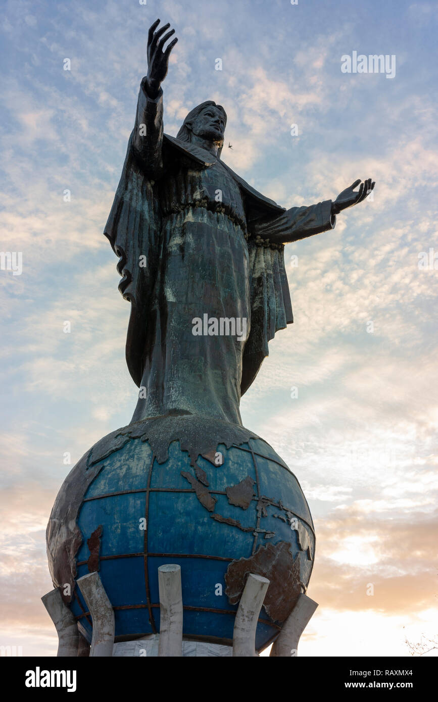 Cristo Rei of Dili, a large statue of Jesus, looks out to sea near Timor Leste's capital. Stock Photo