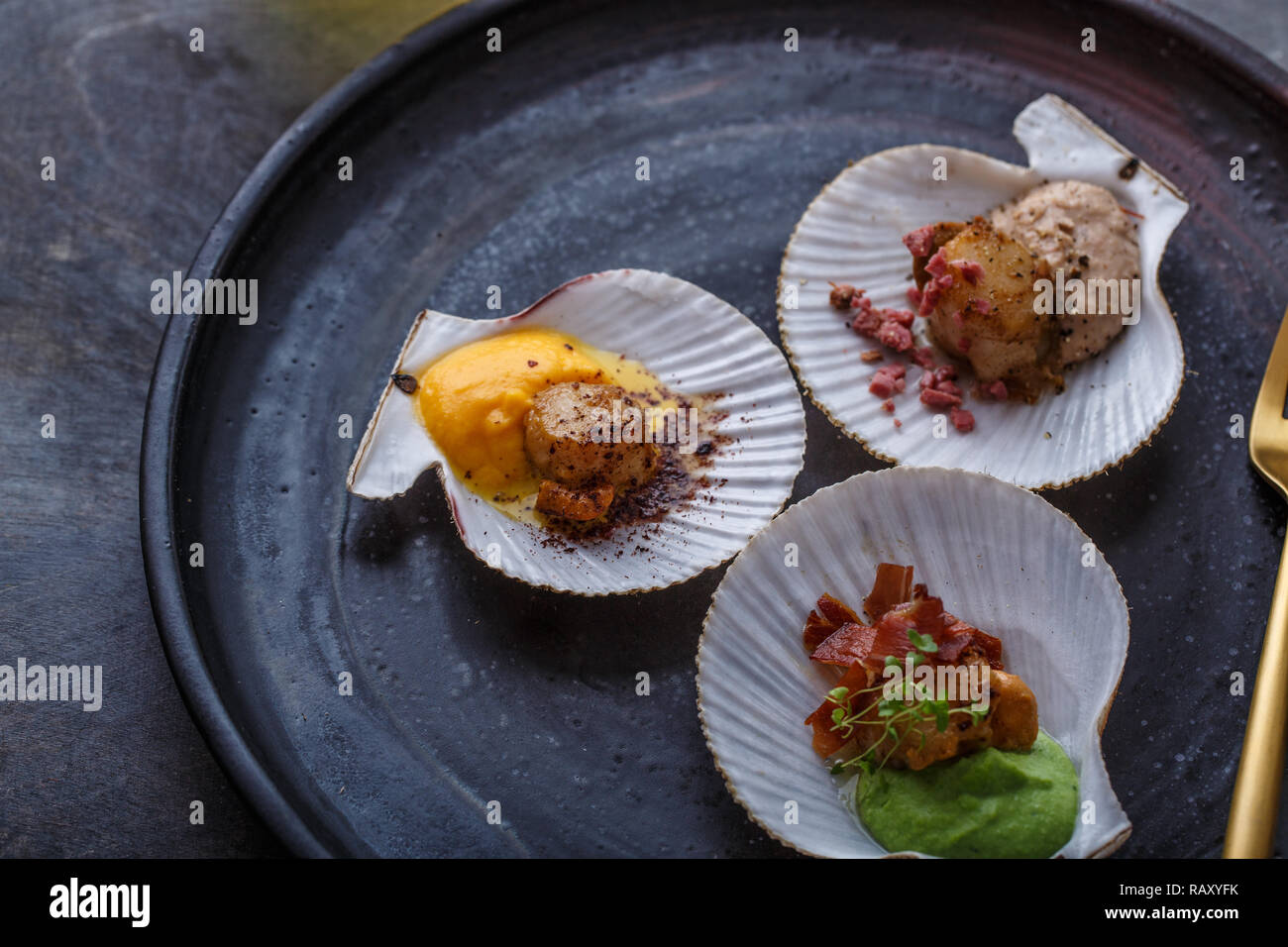 Grilled scallops shell with puree, close view, restaurant dish Stock Photo Alamy