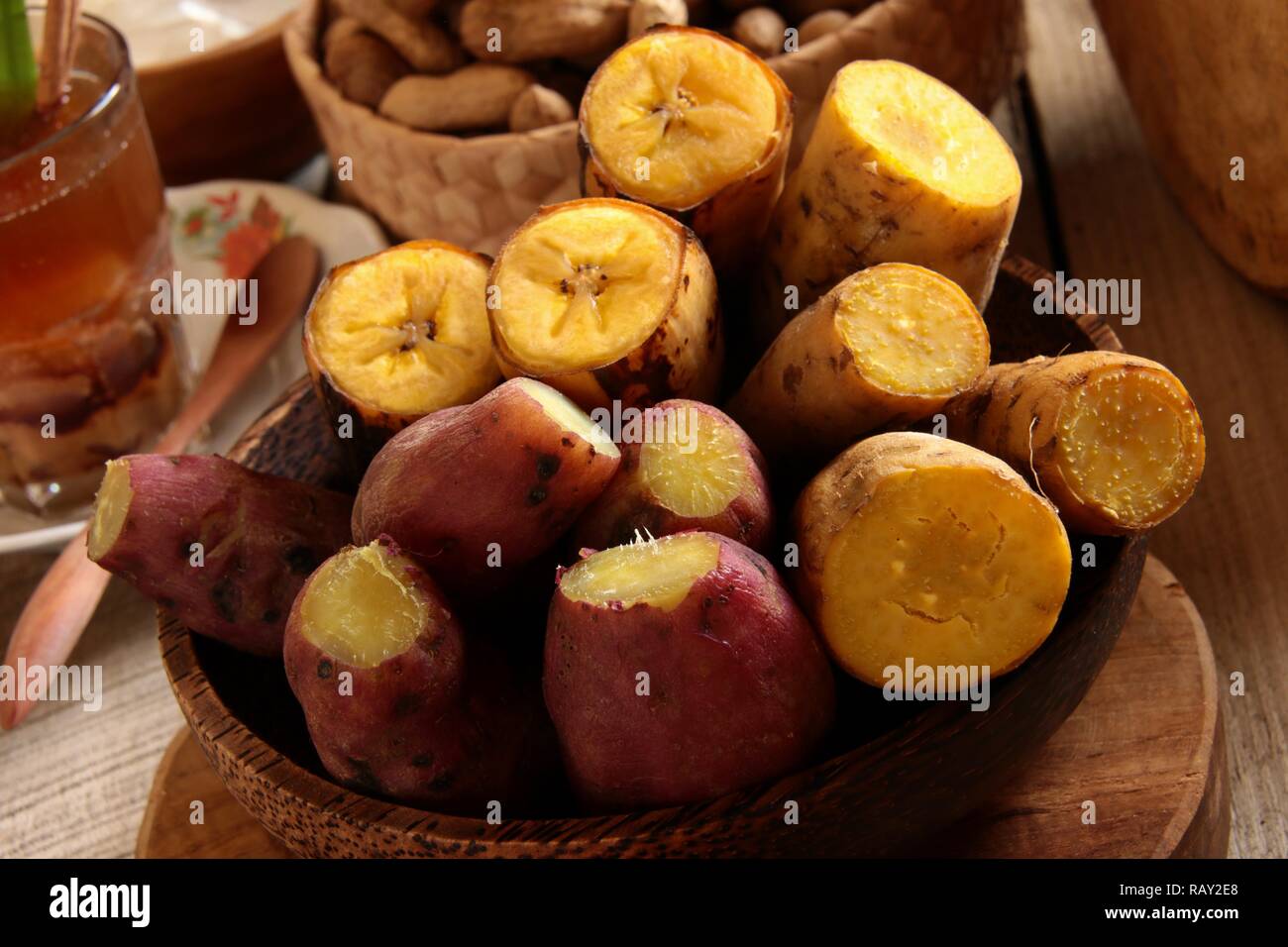 Pisang Rebus and Ubi Rebus. Steamed banana plantain and sweet potatoes, popular snack that served with Sundanese herbal drinks of Bandrek and Bajigur. Stock Photo
