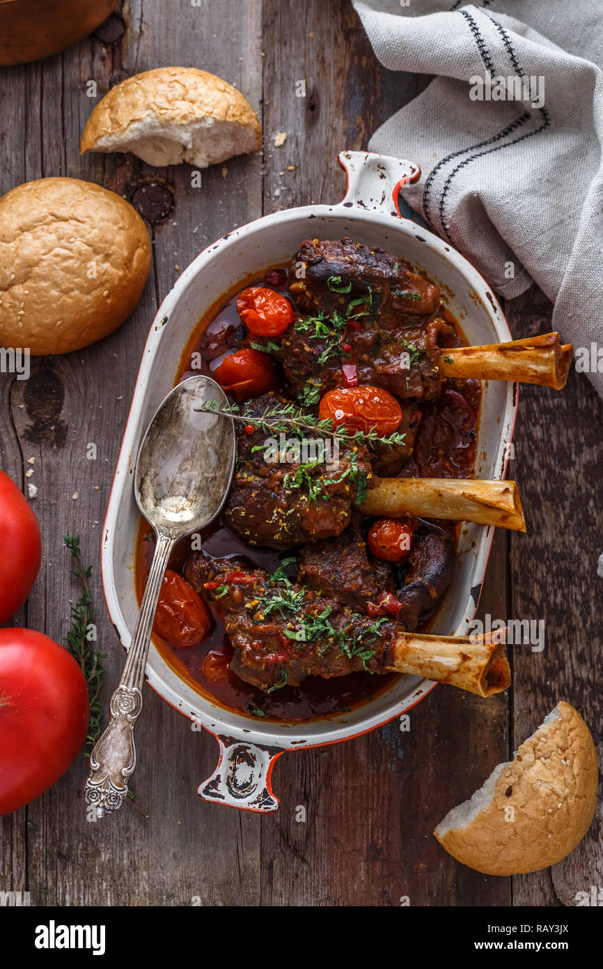 Turkish cuisine braised lamb in tomato sauce with spices and herbs. Stock Photo