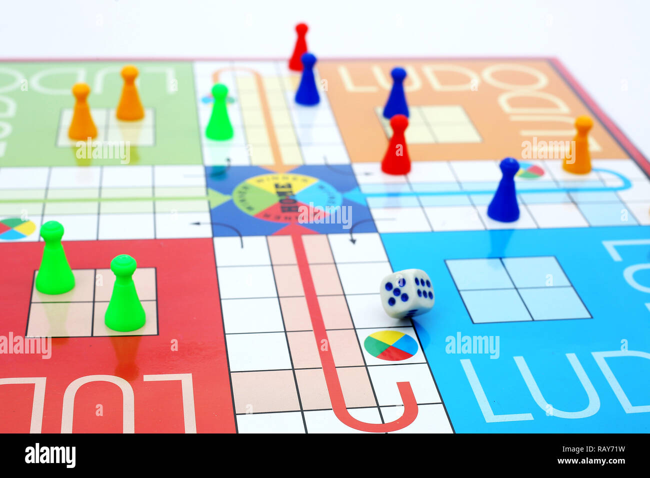 Ludo game with colorful ludo tokens and dice Stock Photo - Alamy