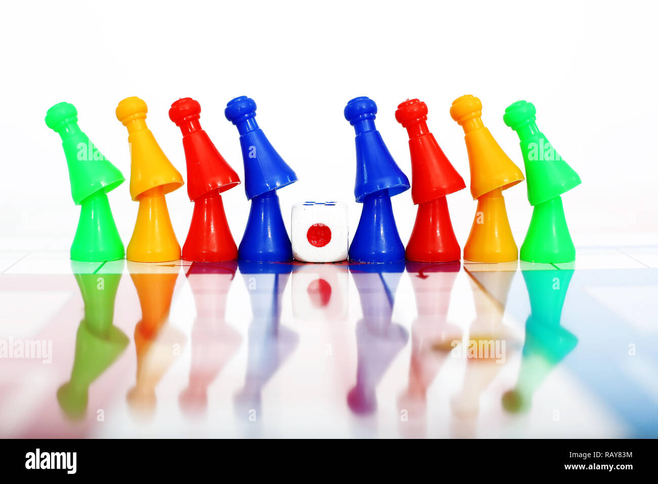 Picture of different color tokens with dice Stock Photo - Alamy