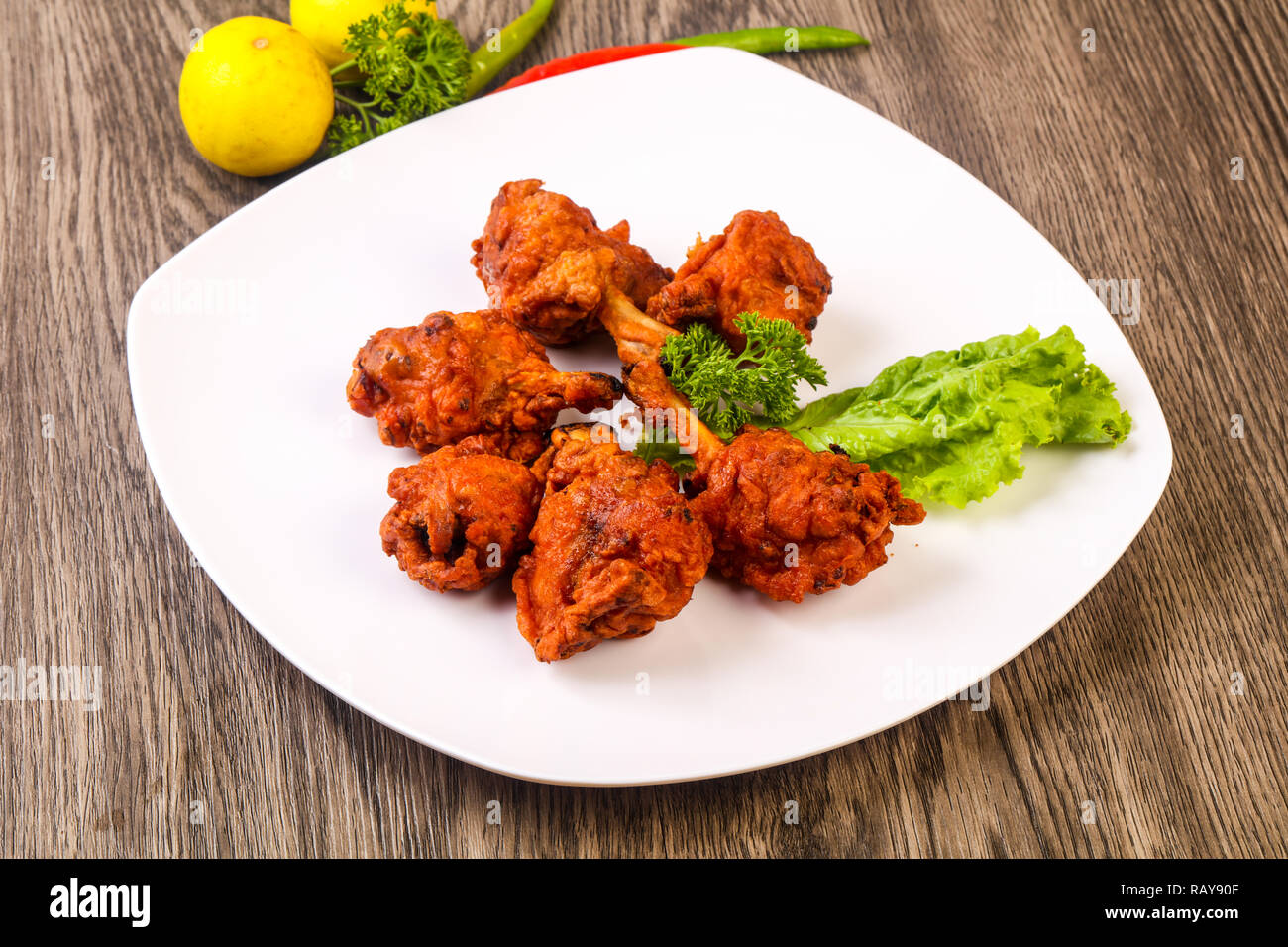 Indian traditional cuisine Chicken lollipops with spices Stock Photo