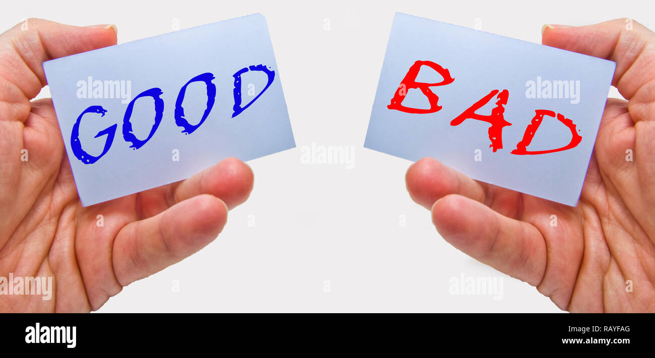 good and bad choice signs in man hands on a white background. for business and education concepts Stock Photo