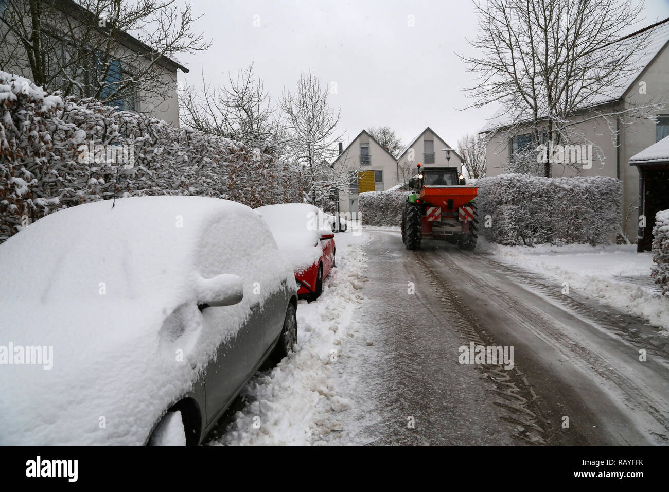 Cleaning of fresh snow on the streets of small town Stock Photo - Alamy