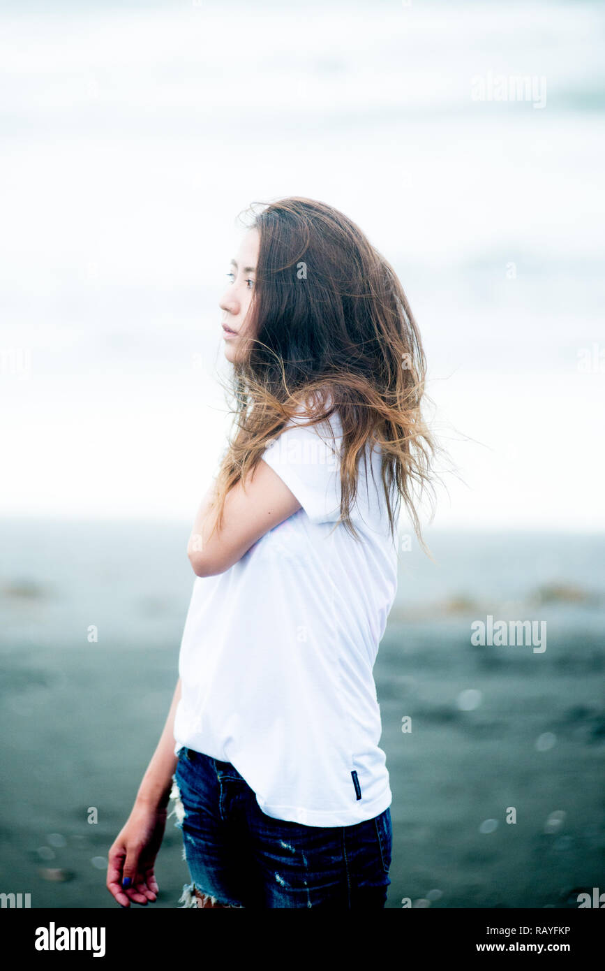 Asian female model poses for pictures on the street Stock Photo