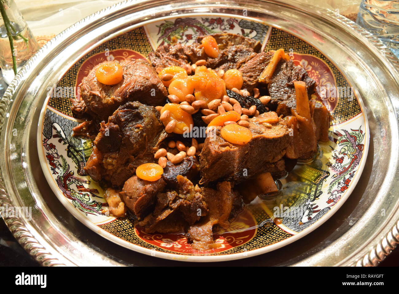 Moroccan dish with meat, plums and sesame seeds close up Stock Photo